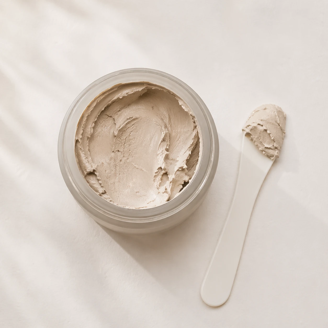 Exfoliating face mask product on a white surface